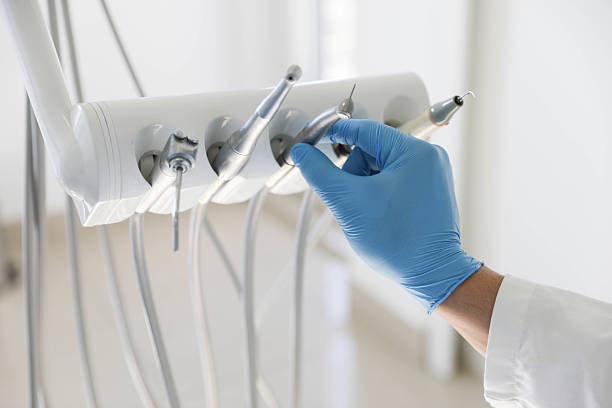Professional Tooth Extraction technician working in Merriam, KS
